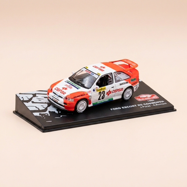 Voiture miniature - Ford Escort RS Cosworth blanche et orange numéro 23 - rallye de Monté-Carlo