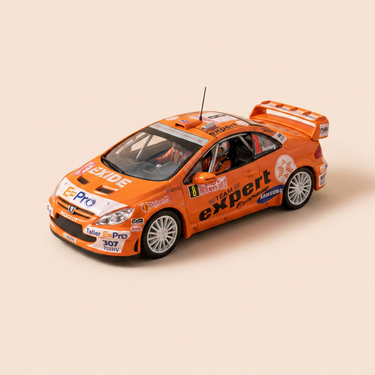 Voiture miniature - Peugeot 307 WRC orange numéro 8 - rallye de Monté-Carlo de 2006