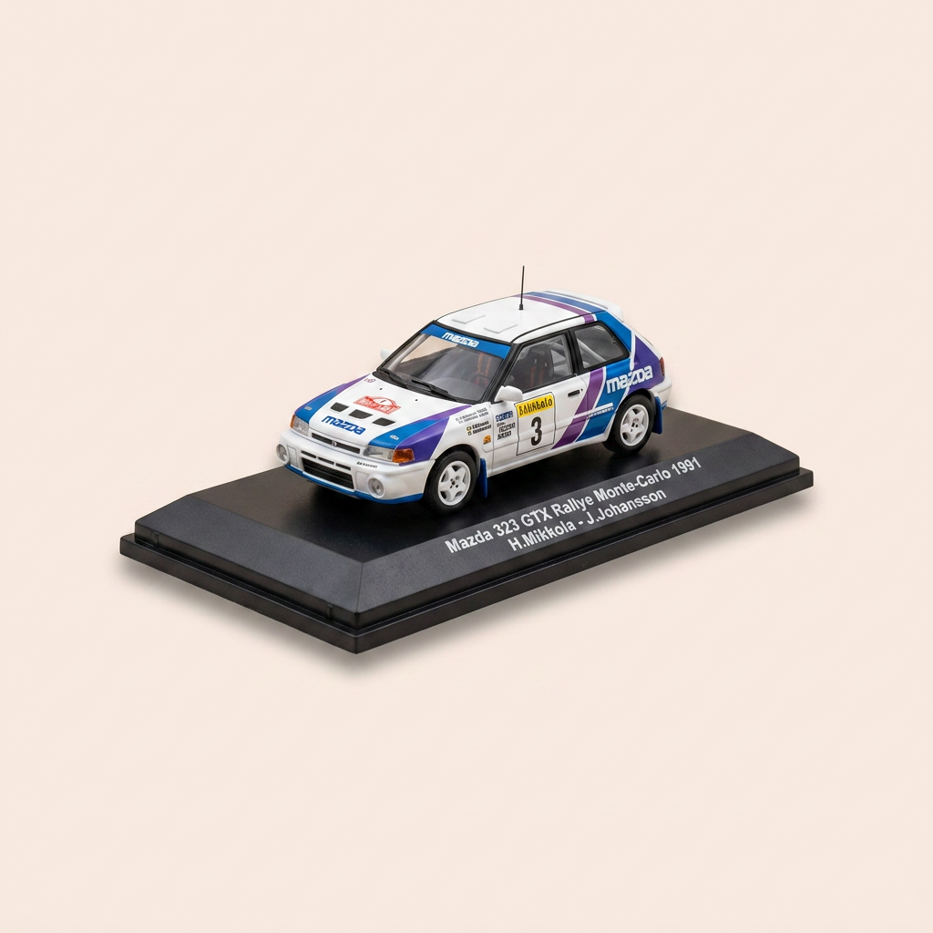 Mazda 323 GTX blanche, bleue, verte et violette numéro 10 - rallye de Monté-Carlo de 1991