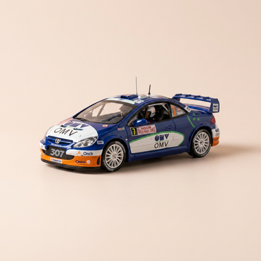 Voiture miniature - Peugeot 307 WRC bleue et blanche numéro 7 - rallye de Monté-Carlo de 2006