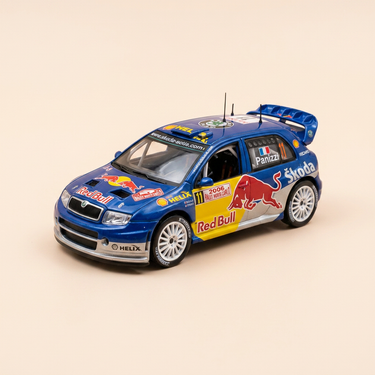 Voiture miniature - Skoda Fabia WRC bleue, jaune et grise numéro 11 - rallye de Monté-Carlo de 2006