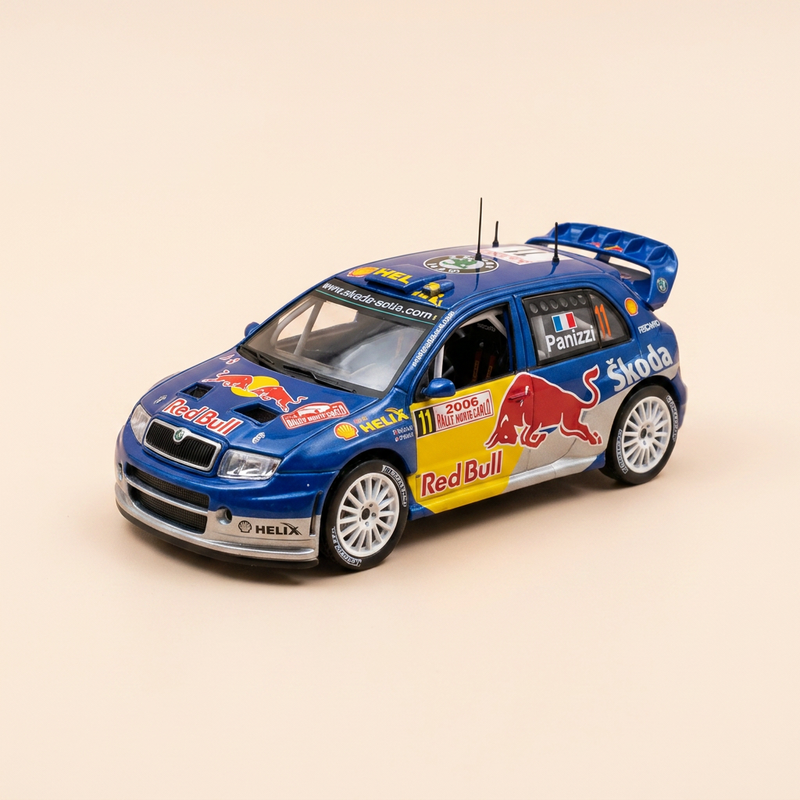 Skoda Fabia WRC bleue, jaune et grise numéro 11 - rallye de Monté-Carlo de 2006