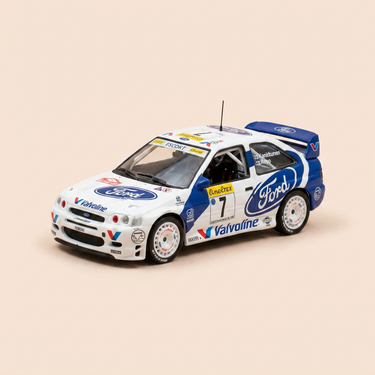 Voiture miniature - Ford Escort WRC blanche et bleue numéro 7 - rallye de Monté-Carlo de 1998