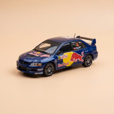 Voiture miniature - Mitsubishi Lancer Evo IX bleue numéro 74 - rallye de Monté-Carlo de 2007