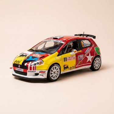 Voiture miniature - Fiat Grande Punto S2000 jaune et rouge - rallye de Monté-Carlo de 2010