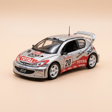 Voiture miniature - Peugeot 206 WRC grise et rouge numéro 20 - rallye de Monté-Carlo de 2003