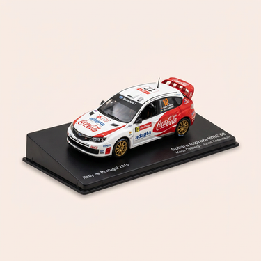 Voiture miniature - Subaru Impreza WRC 08 blanche et noire numéro 12 - rallye du Portugal de 2010
