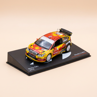 Voiture miniature - Citroën C4 WRC jaune, rouge et noire numéro 11 - rallye du Mexique de 2010